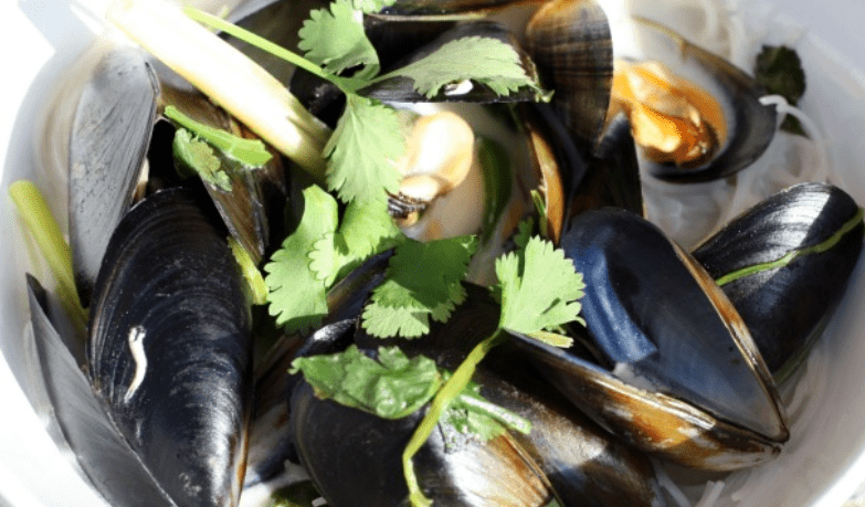 Coconutty Mussels with Ginger, Lemongrass, Chili, and Cilantro on Rice Noodles