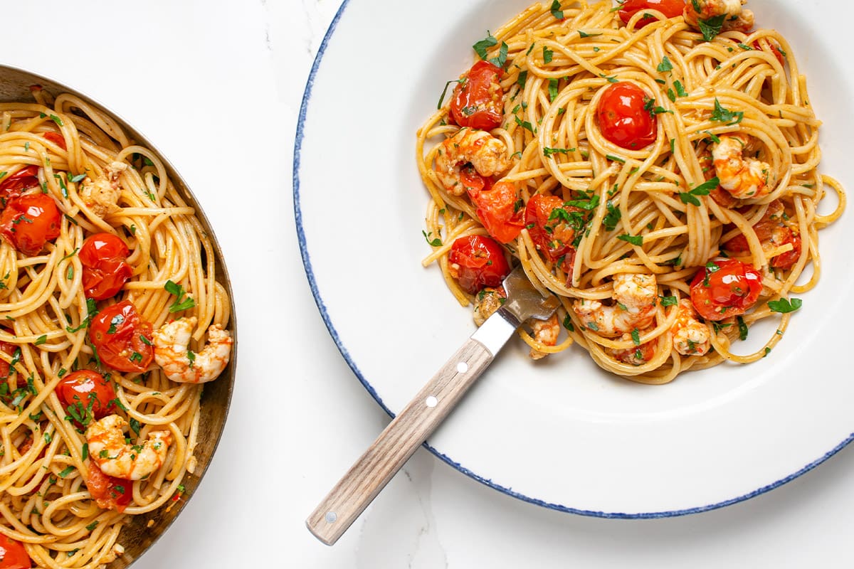 A bowl of chilli, garlic, cherry tomato, and spot prawn spaghetti.