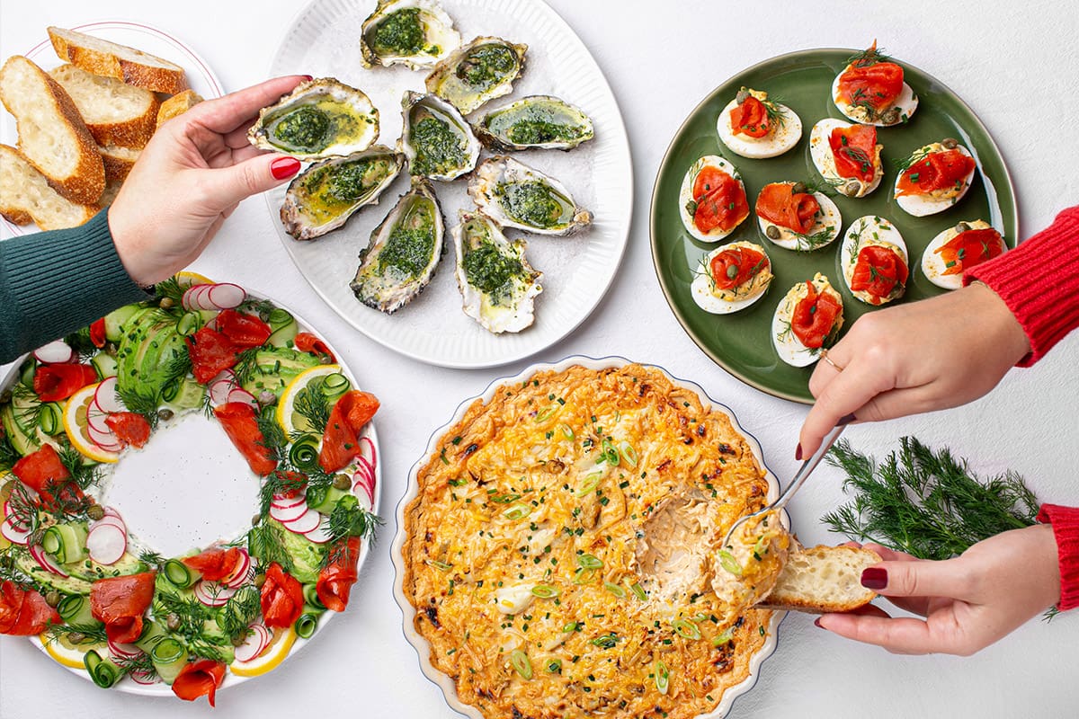 Holiday appetizers are arranged on a table.