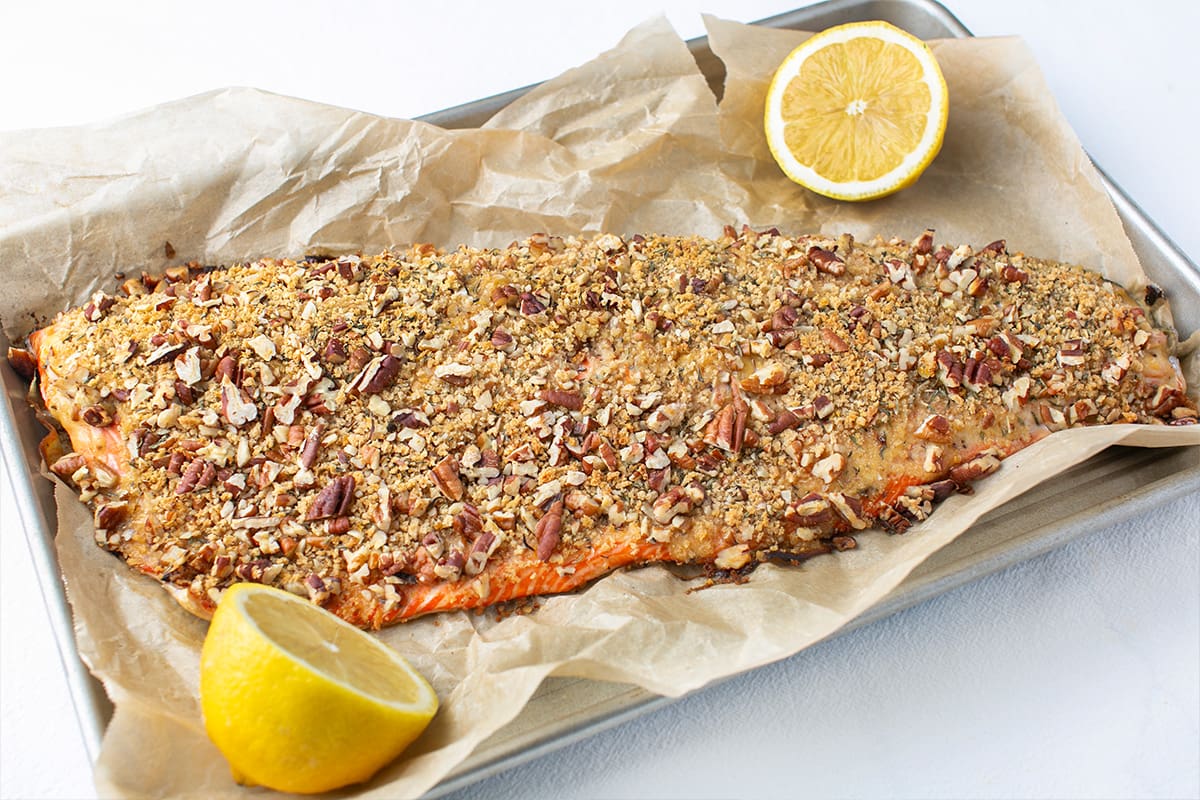 A full side of baked sockeye salmon topped with a honey mustard glaze and pecan crumb.